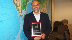 Dr. Shirk receives the 2016 International Impact Award. Source: USD News Center
