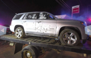 SUV with bullet holes caught between crossfire during operation
