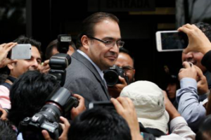 Javier Duarte, some months before he fled Mexico, standing outside of PRG headquarters in Mexico City. Source: The New York Times